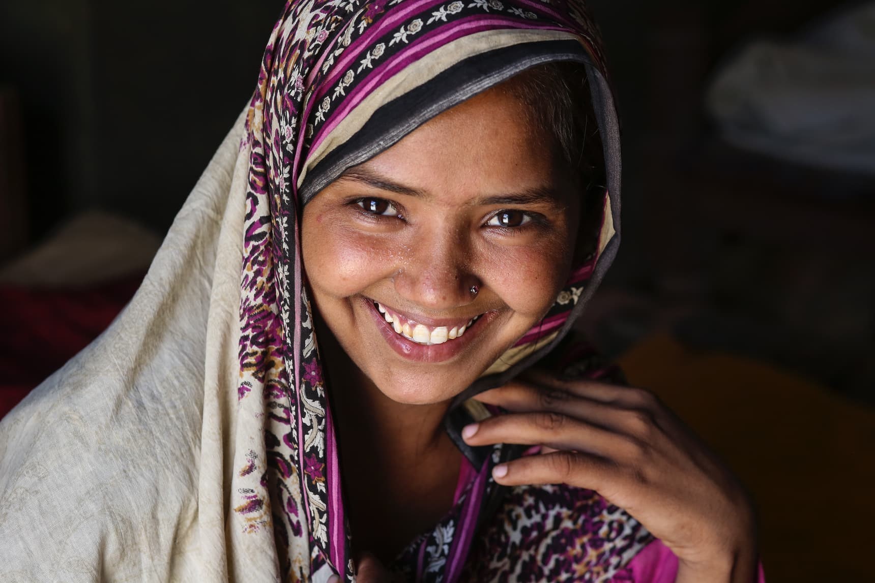Girl wearing headscarf, smiling