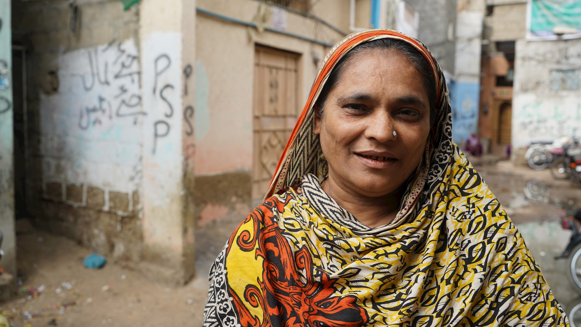 Woman in front of urban background, Pakistan