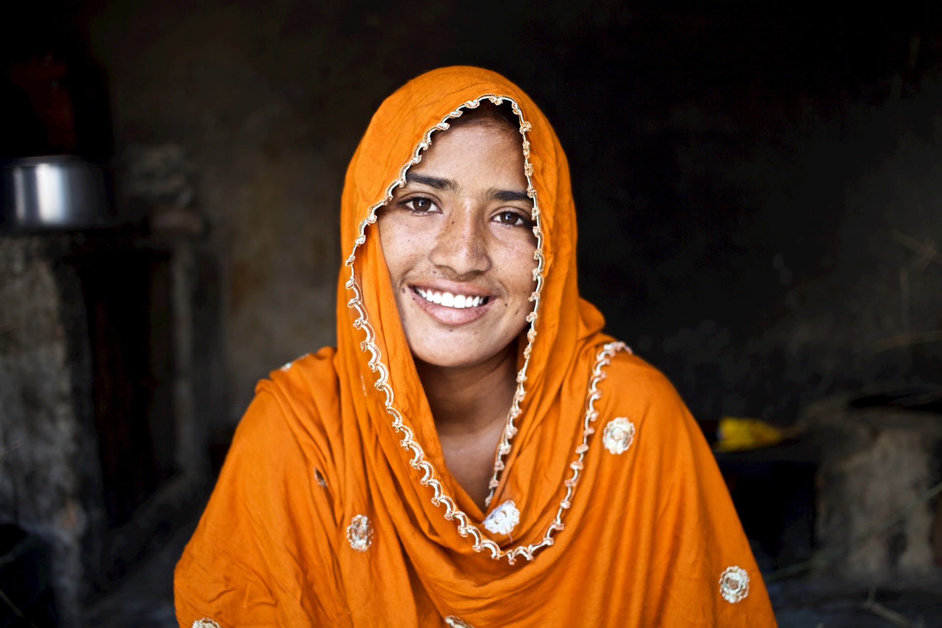 woman in headscarf looking to camera 