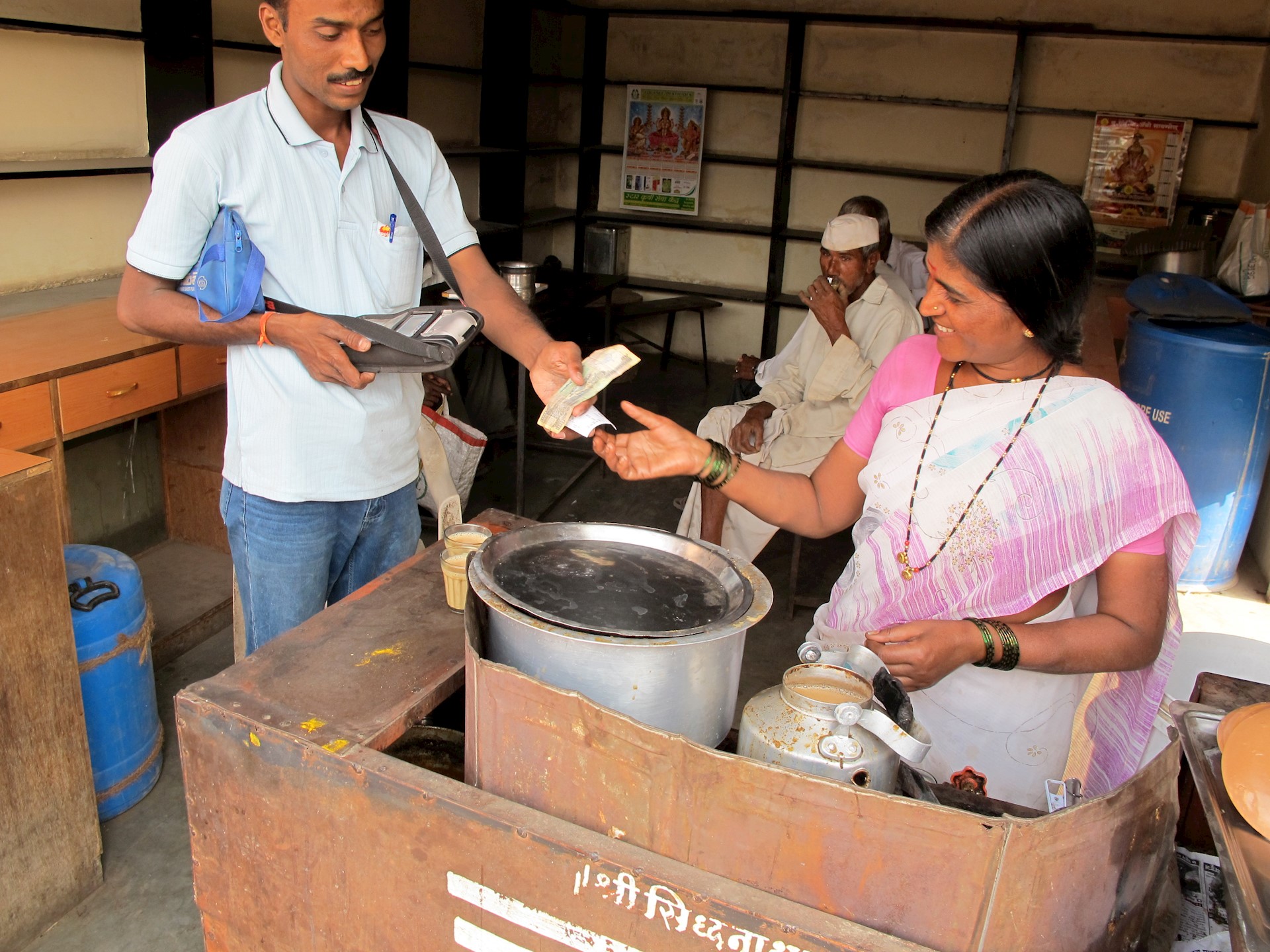 man and woman exchanging currency