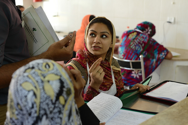 Woman learning in class, Pakistan