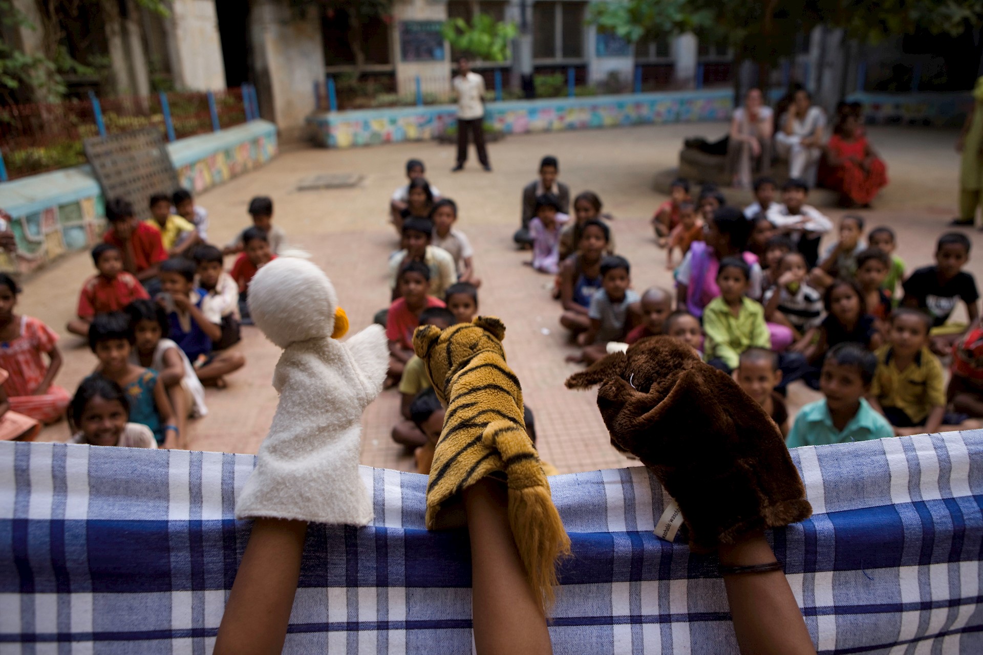 children watching a puppet show