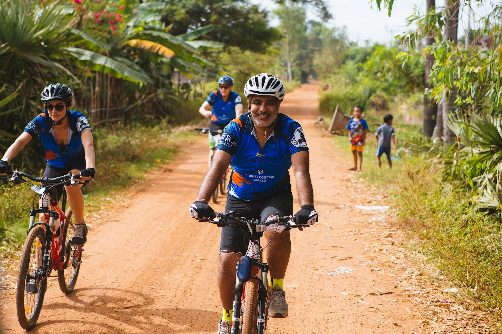 supporter riding bikes in Cambodia 