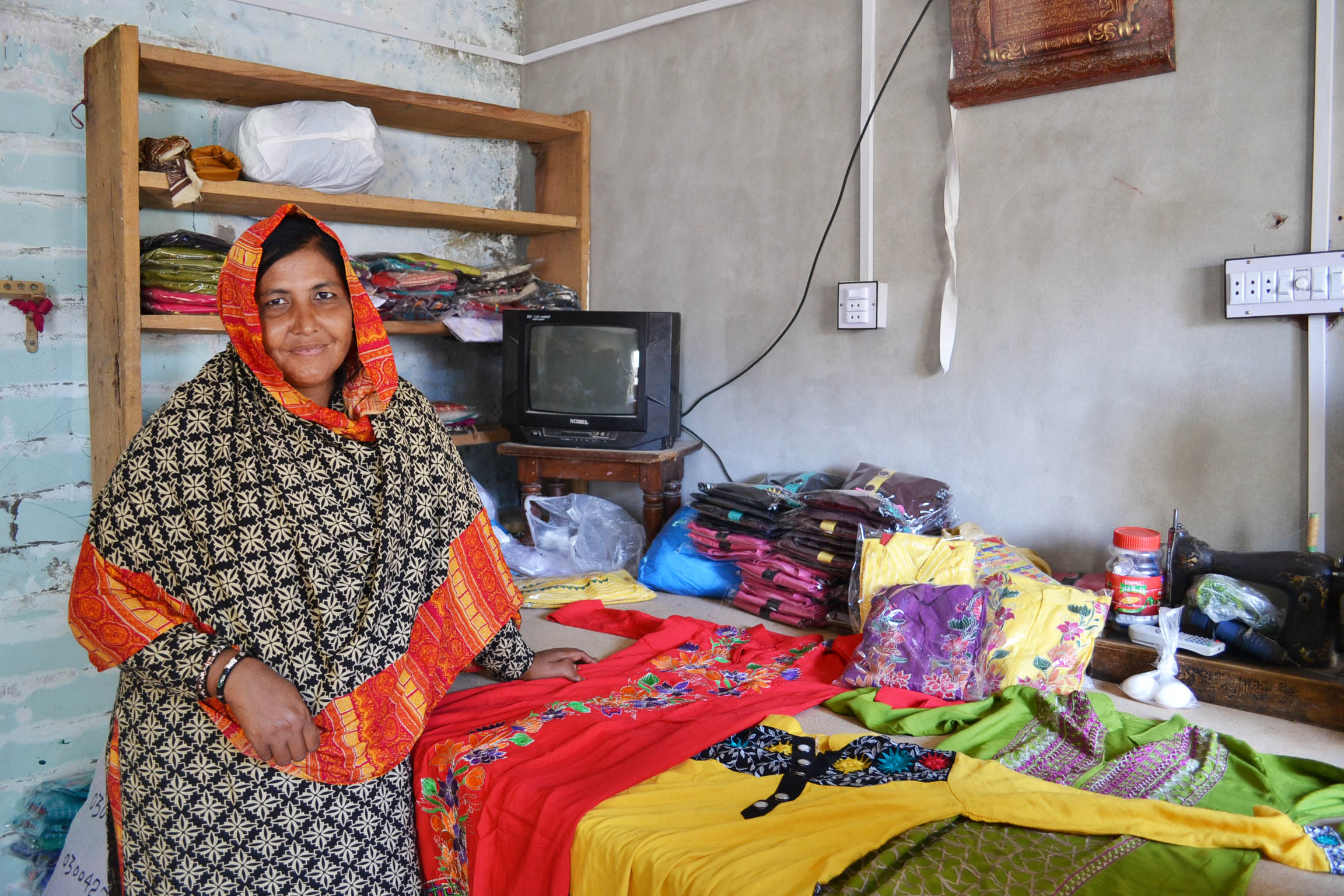 woman posing with her sewing works 