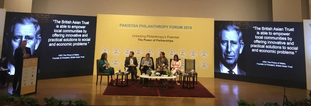  panel discussion taking place on stage 