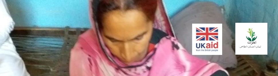 woman looking down sewing 