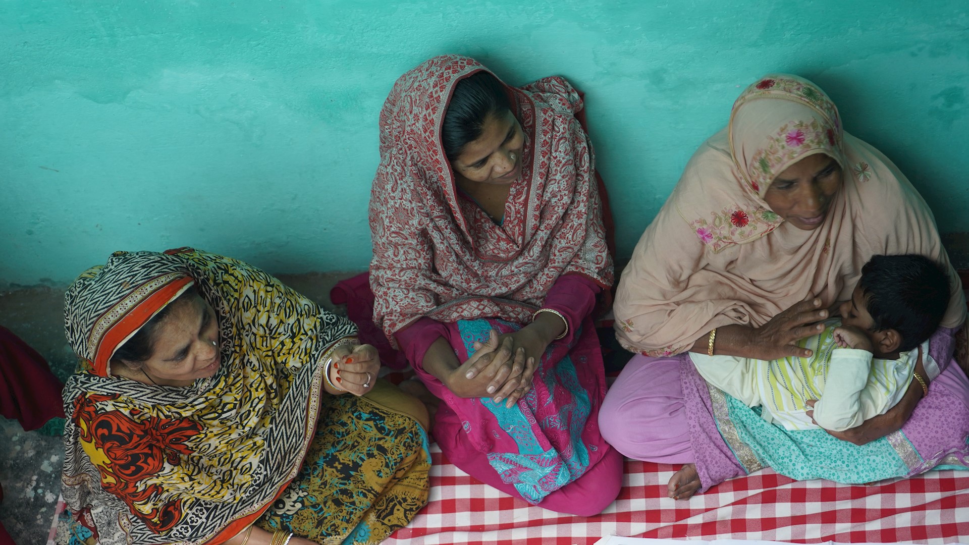 three women sat in mental health meeting 