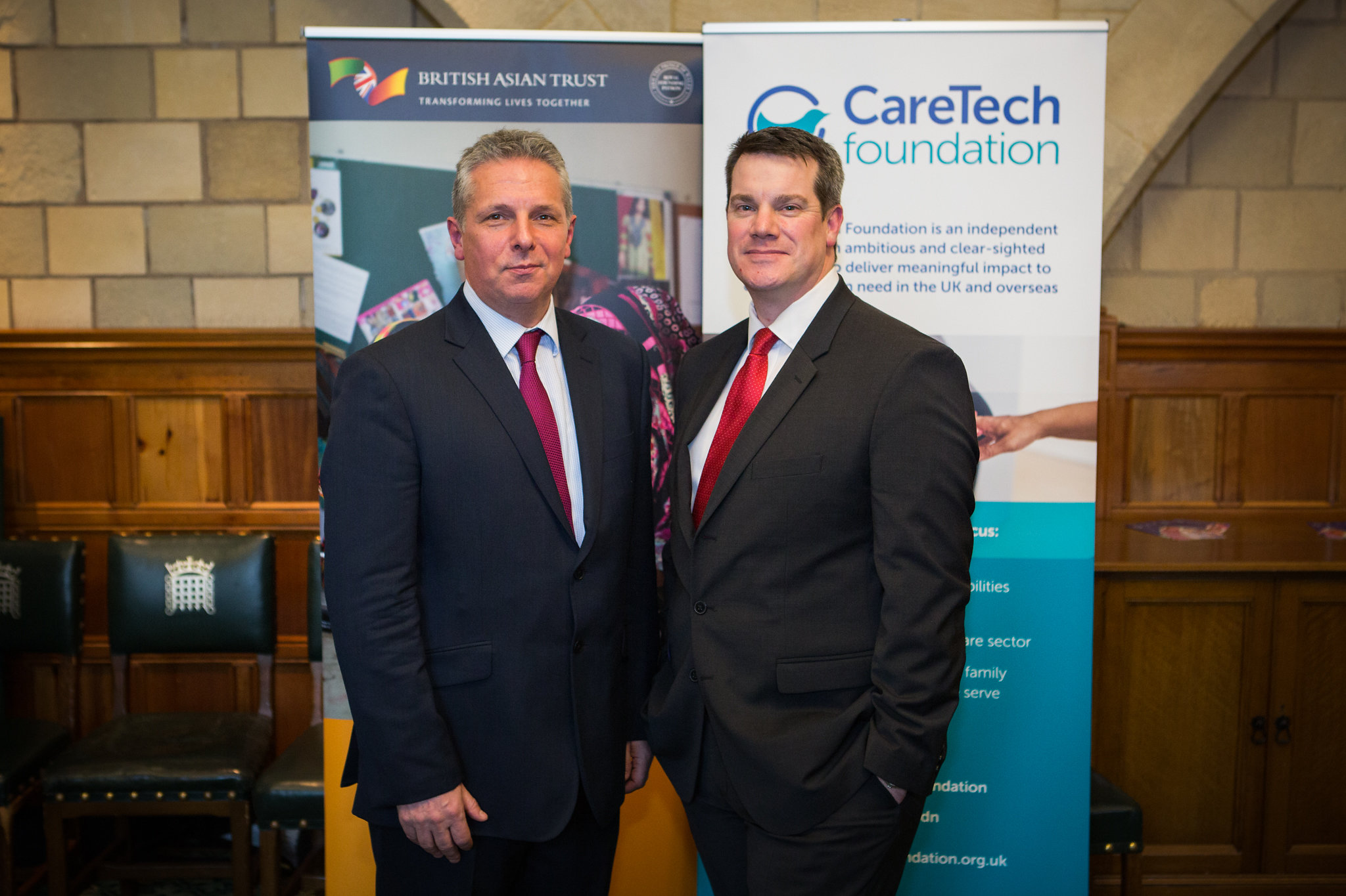 CEO British Asian Trust and CEO of Caretech posing at partnership launch event 