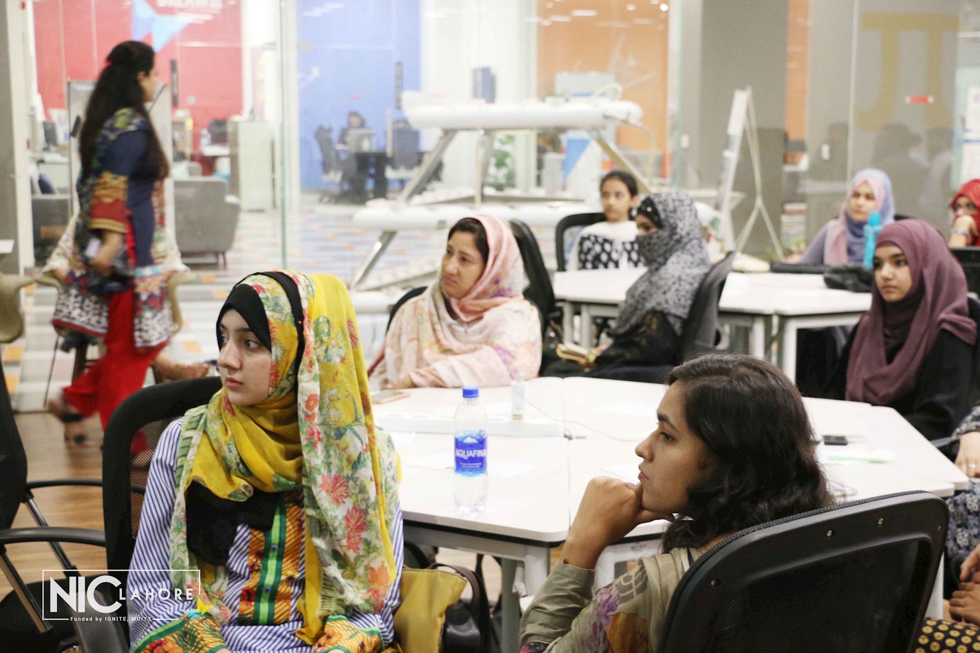 Women sat in a classroom, Pakistan 