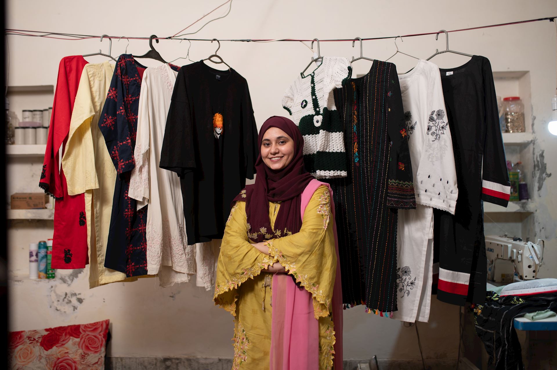 Thriving Futures Woman In Front Of Clothing